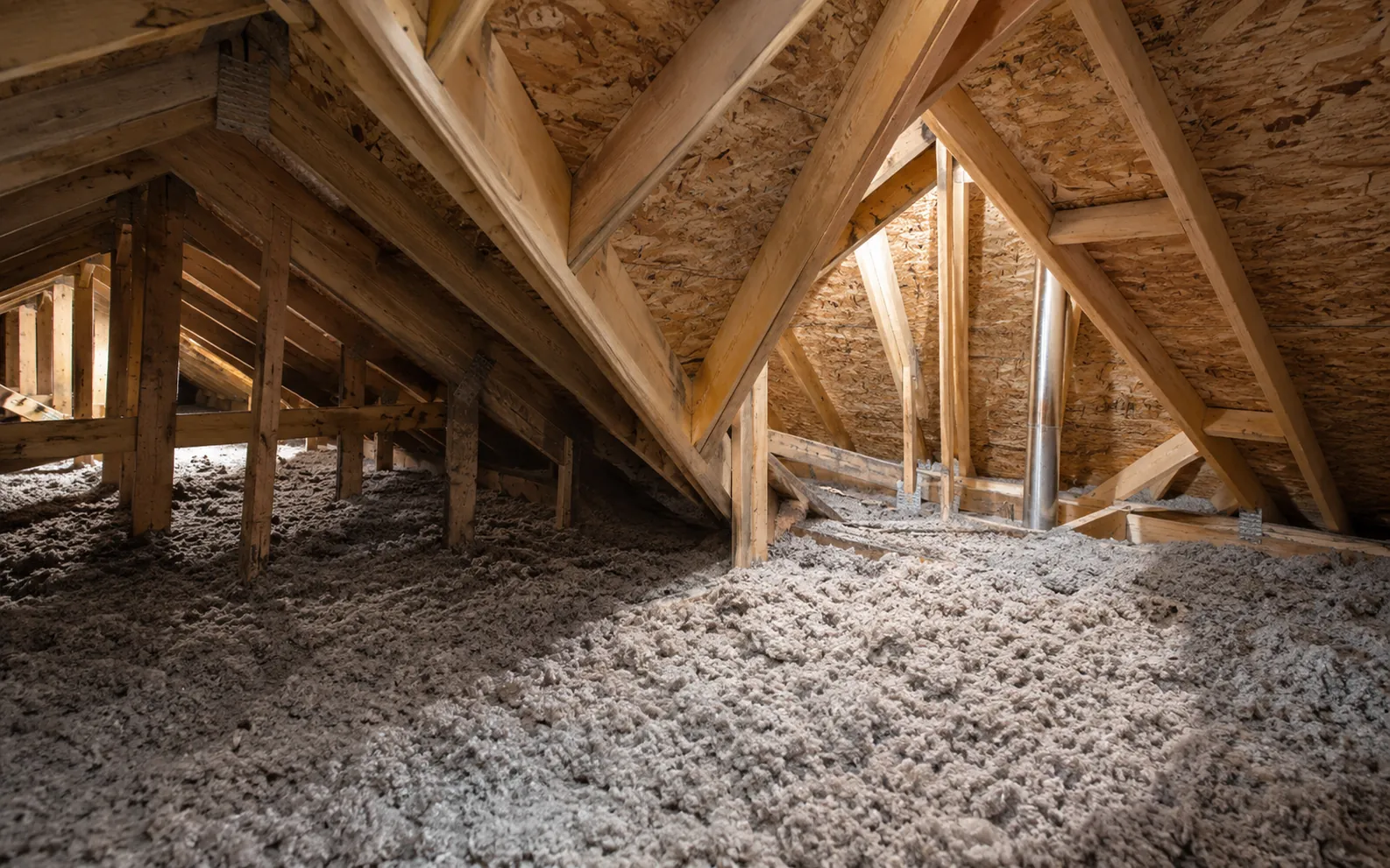 Intersecting timber roof spaces with different access heights above existing insulation.