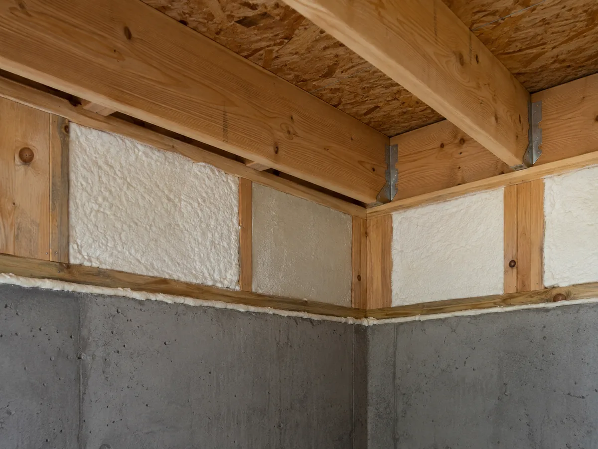 Insulation between floor-framing members at the rim-joist area above a foundation wall.